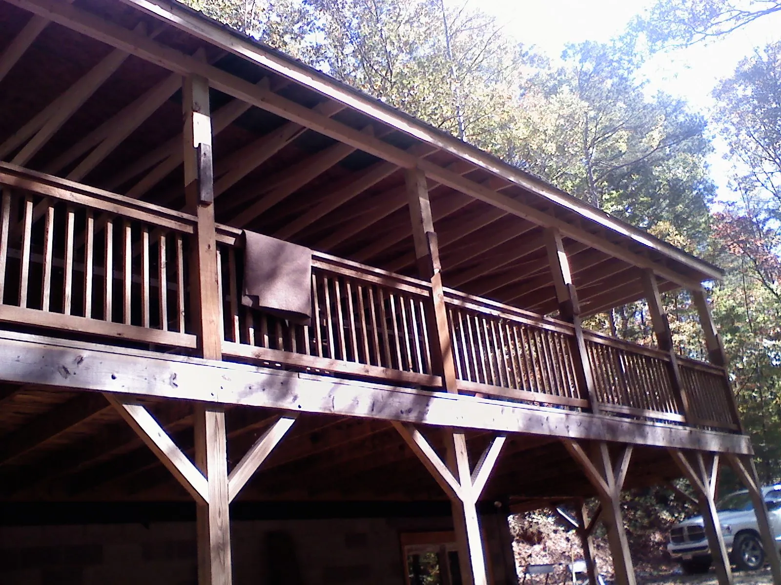 Timber framing under a new elevated porch and deck — Roof Leak Repair in Loranger by Roofing Brothers